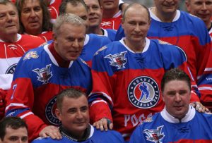 SOCHI, RUSSIA - MAY, 10 (RUSSIA OUT) Russian President Vladimir Putin (C),  former NHL player Slava Fetisov (L) and Tula region Governor Alexei Dumin (2L) lseen during the match of the Night Hockey League in Sochi, Russia, May,10,2016. Putin attended a hockey match with NHL veterans, Putin's team won 11: 5. (Photo by Mikhail Svetlov/Getty Images)