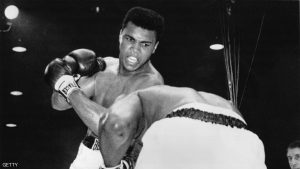 FEBRUARY 25, 1964: Cassius Clay (now Muhammad Ali) in action against Sonny Liston during their heavyweight title fight at Miami Beach, Florida. Clay won the contest, becoming world champion, when Liston failed to come out at the start of the seventh round. (Photo by Central Press/Getty Images)
