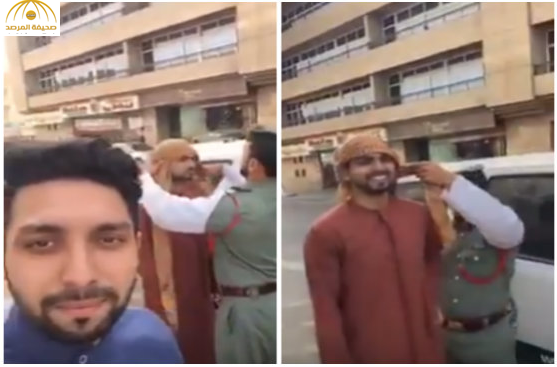بالفيديو: شرطي مرور دبي يلف "الغترة" على رأس سائح