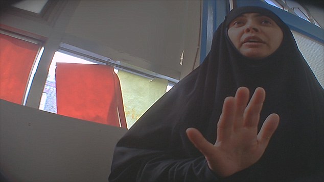 *Channel 4 broadcast ISIS: The British women supporters unveiled on Nov 23, 2015. * The photo is a woman who calls herself Umm Luqman, but is in fact Rubana Akhtar, the wife of jailed hate-preacher Anjem Choudary. * She held a series of meeting with women and children in East London spouting vile messages mocking the Jordanian pilot burned alive, and railing against non-Muslims and in praise of Islamic State. ***IMAGE SUPPLIED BY CHANNEL 4***