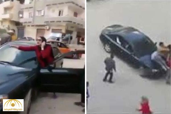 بالفيديو : فتاة مصرية تدهس شبان خلال مشاجرة مسلحة!