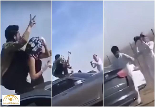 بالفيديو  والصور: ‏فتاة  تحمل زجاجة خمر  وترقص على سقف سيارة بي أم دبليو
