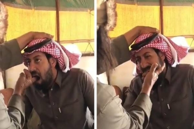 A traditional healer places his fingers inside the throat of a sick person • Al Marsad Newspaper