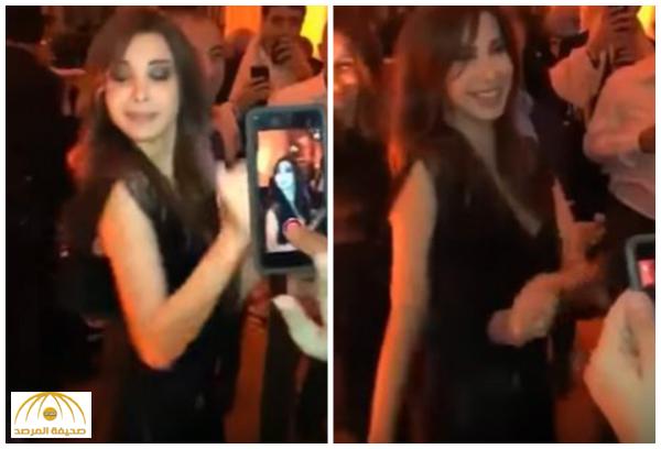 بالفيديو : نانسي عجرم ترقص على واحدة ونص مع وزير التربية والتعليم اللبناني !