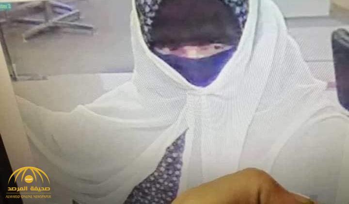 شاهد : لص مسلح يستخدم الزي النسائي في إخفاء هويته ويسطو على بنك في الأردن