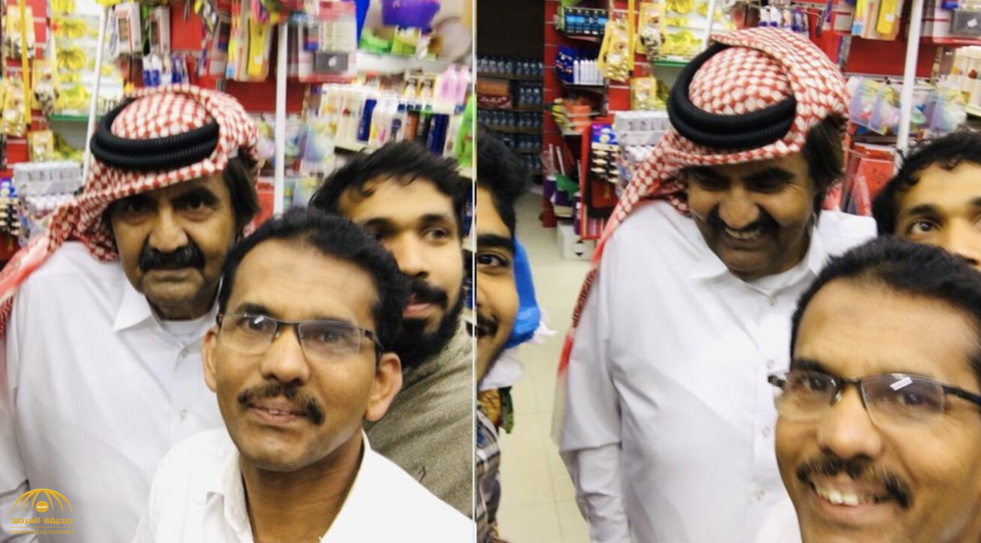 شاهد..  أمير قطر السابق "وحيدا" يلتقط صور سيلفي مع هنود داخل بقالة في الدوحة!