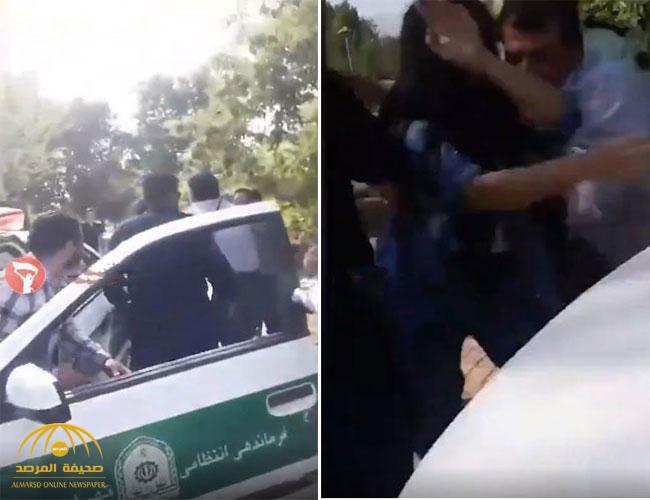 انكشف جسمها.. شاهد: سحل فتاة إيرانية غير محجبة واعتقالها من الشرطة بسبب "مسدس لعبة"