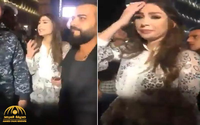 شاهد : مذيعة لبنانية شهيرة تصرخ بعد نشل تليفونها من قبل أحد مناصري حزب الله