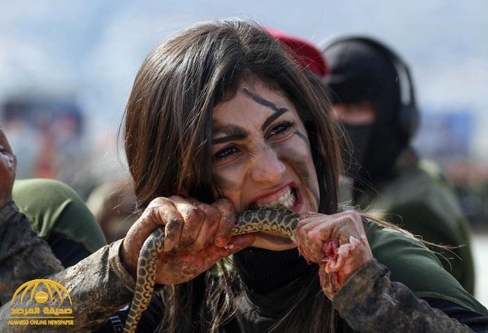 شاهد: فتيات من قوات "البشمركة الكردية" يلتهمن ثعابين وزواحف برية