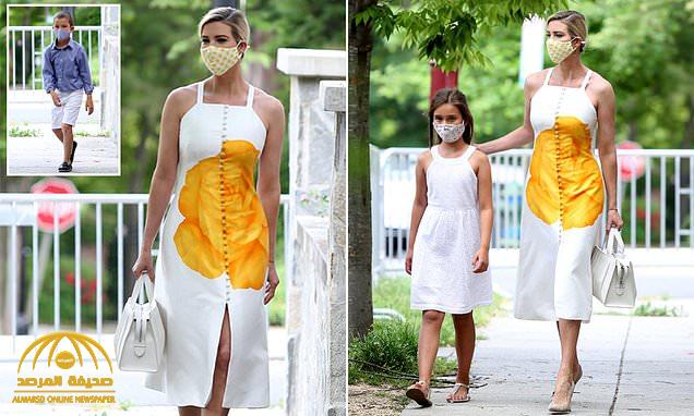 بالصور: إطلالة "لافتة" لإيفانكا بكمامة وفستان أبيض مرصع بوردة صفراء.. والكشف عن سعره
