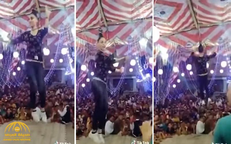 شاهد .. فيديو غريب لفتاة مصرية معلقة من شعرها ترقص في الهواء في فرح شعبي