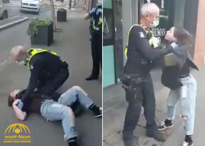 شاهد: شرطي إسترالي يخنق فتاة ويطرحها أرضاً ويضع ثقل جسمه عليها لأنها رفضت ارتداء الكمامة