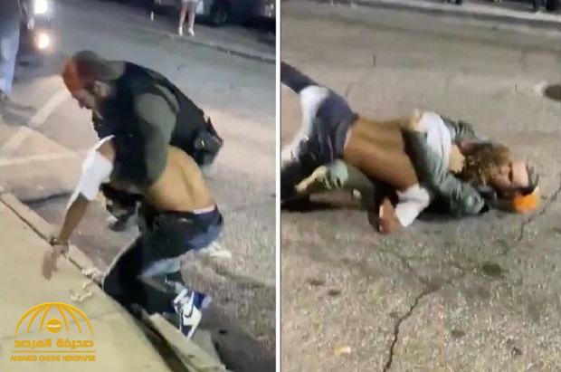 بعدما حاول فض مشاجرة بالشارع.. شاهد: شاب أمريكي يسقط شرطيًا على الأرض ويوجه له لكمات عنيفة
