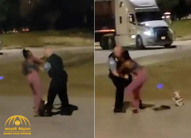 شاهد: شرطي أمريكي يعتدي على فتاة من أصول أفريقية وكلبها يحاول الدفاع عنها