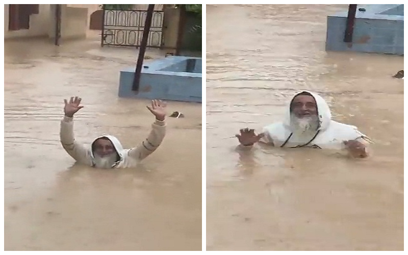 شاهد: مُسن عُماني يسبح  داخل مياه سيول إعصار "شاهين"