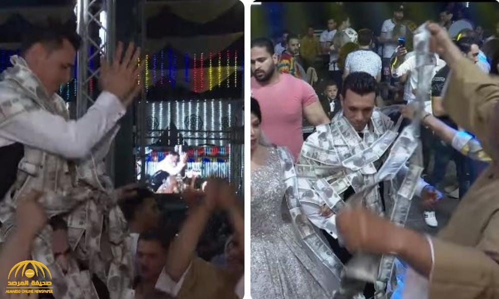 مصر.. شاهد : رجل يهدي عريس نصف مليون جنيه في حفل زفافه بطريقة مثيرة